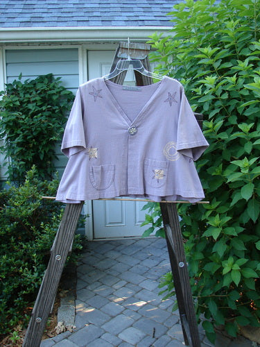1997 Cove Jacket Star Fish Coral Reef Jasmine Size 1 displayed on a clothes rack, featuring a flared A-line shape, single porcelain button closure, V neckline, and two small rounded pockets.