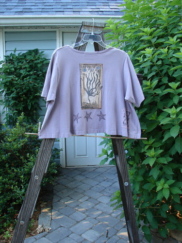 1997 Cove Jacket Star Fish Coral Reef Jasmine Size 1 on a wooden clothes rack, showcasing its flared A-line shape, V neckline, and unique porcelain button closure.