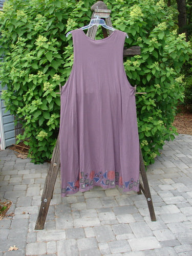 1993 NWT Long Column Vest Metallic Column Dusty Plum OSFA, displayed on a wooden rack, showcasing its deep oval neckline, deeper arm openings, widening lower sweep, and vertical metallic paint with vintage buttons.