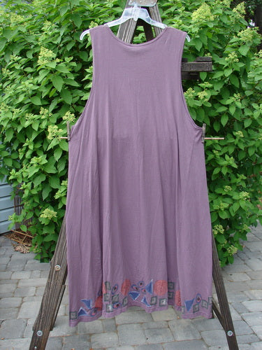 1993 NWT Long Column Vest Metallic Column Dusty Plum OSFA displayed on a rack, featuring deeper arm openings, a widening lower sweep, and a deep oval neckline adorned with vintage wooden buttons.