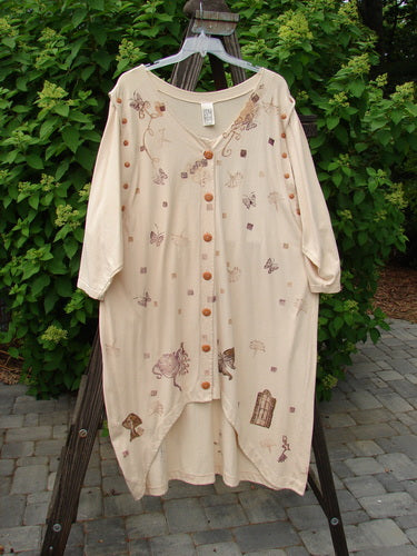 1994 Convertible Coat Spring Garden Tea Dye OSFA displayed on a wooden rack, featuring brown buttons and removable sleeves, highlighting its versatile design and unique spring garden-themed paint.