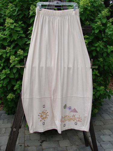 1996 4 Square Skirt Sun Sea Birch Bark Size 2 displayed on a rack, showcasing its organic cotton fabric, 2-inch elastic waist, 4 square bottom hem, and deep side pockets with unique sun and sea pattern.