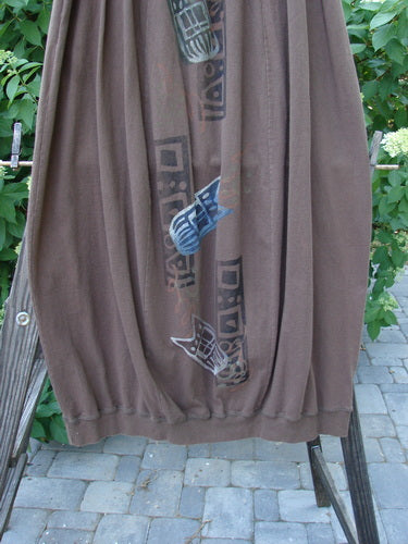 1996 Thermal Whimsical Skirt Tribal Molasses Size 2 featuring organic cotton, abstract tribal design, full elastic waistline, gathered hem, sectional panels, deep side pockets, and a bubble shape.
