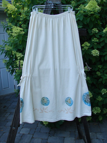 1999 Tie In Skirt Leaf Medallion Natural Size 2, featuring a full elastic waistband, draw cords, and detailed leaf medallion design, presented on a flat surface.