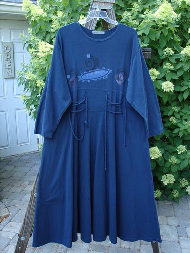 1997 Caryatid Dress with abstract window pane design, featuring long adjustable front and back laces, and a wide A-line lower with drop shoulders, displayed on a swing.