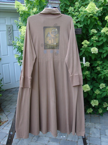 1995 Virginia Woolf Dress Home Tree Cottage Brown Size 2, displayed on a mannequin, features front snaps, ribbed turtleneck, sweeping hemline, and deep pockets, adorned with vintage home and forest theme paint.
