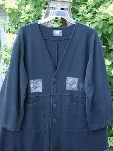 1999 Interlock Stellar Jacket Celtic Flower Black Size 0, featuring a signature Blue Fish patch, detailed metallic flower design, large front pockets, and oversize front buttons, made from heavy-weight cotton interlock.