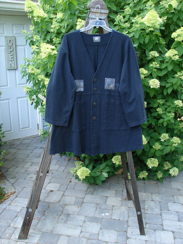 1999 Interlock Stellar Jacket Celtic Flower Black Size 0: Blue jacket on wooden stand with metallic holiday paint, large front pockets, vented sides, oversized buttons, bell sleeves, and empire waist seam.