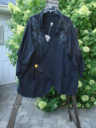Barclay NWT Hemp Cotton Tidal Jacket Roses Black Size 2 displayed on a stand, featuring oversized button closure, drop pockets, and climbing rose design.
