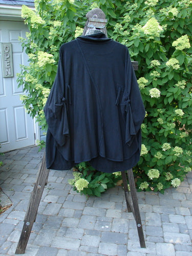 Barclay NWT Hemp Cotton Tidal Jacket Roses Black Size 2 displayed on a wooden stand, showcasing oversized button closure, unique S curved seam, and exterior drop pockets.