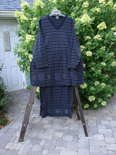 1999 Stripe Box Straight Tie Duo Water Fern Black Size 2 featuring a striped shirt and matching skirt on a rack, showcasing the unique A-line shape, ribbed V-neckline, and pegged skirt with side ties.