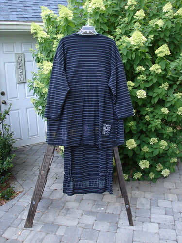1999 Stripe Box Straight Tie Duo Water Fern Black Size 2: Striped shirt and matching skirt displayed outdoors on a stand, showcasing the versatile design and unique detailing from the Fall 1999 collection.