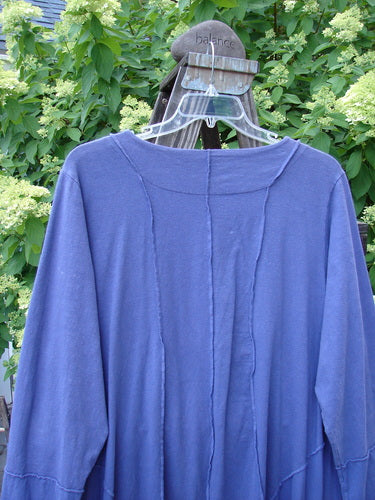 Barclay Cotton Lycra Two Tier Sectional Jacket Unpainted Bloomsberry Size 2 displayed on a hanger, featuring a full button front, rounded neckline, swingy side inserts, and cuffable lower sleeves.