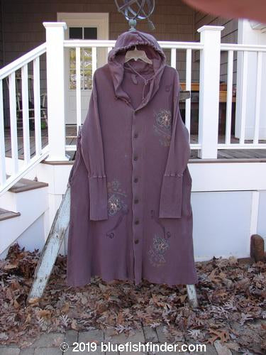 1995 Thermal West Wind Coat Hooded Butterfly Currant Size 1: A long purple coat with an oversized hood and ribbed sleeves, featuring a butterfly theme paint and metal buttons.