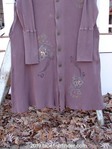 1995 Thermal West Wind Coat Hooded Butterfly Currant Size 1: A purple thermal coat with a butterfly design, oversized hood, ribbed sleeves, and metal buttons. Features deep pockets and a varying hemline.