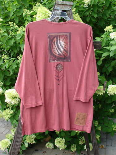 1996 Elements Everyday Jacket Primitive World Ember Size 1 on a hanger, showcasing its long sleeves, scribe buttons, and two painted drop pockets with a slightly narrowing shape.