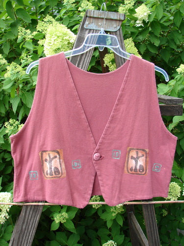 1996 Simple Vest Primitive Ember OSFA: A pink vest with designs on it, featuring a scooped back hemline and a contrasting front pointed hemline. Etched single button closure and deep V neck.