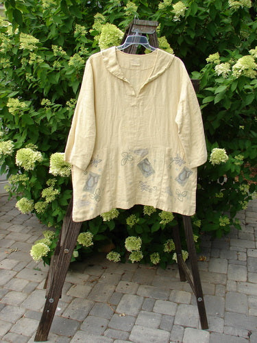 1999 Linen Antique Top Garden Plantain Size 1 displayed on a swing, showcasing vented sides, V neckline, rounded pockets, and a garden theme paint design.