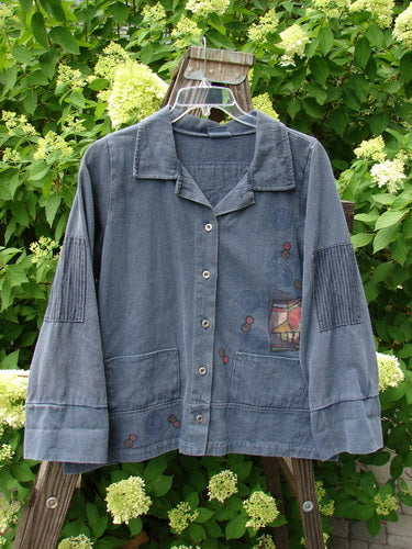 Barclay Patched Canvas Barn Jacket with stand-up collar, double front patches, sectional panels, and metal button front displayed on a swinger. Blue Jean Stripe design, durable canvas hemp material.