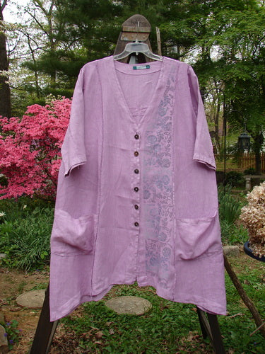 Barclay Linen Double Tie Back Jacket Garden Side Lilac Size 2 displayed on a swinger, showcasing its unique A-line sweep, deep V-neckline, and detailed garden-themed paint.
