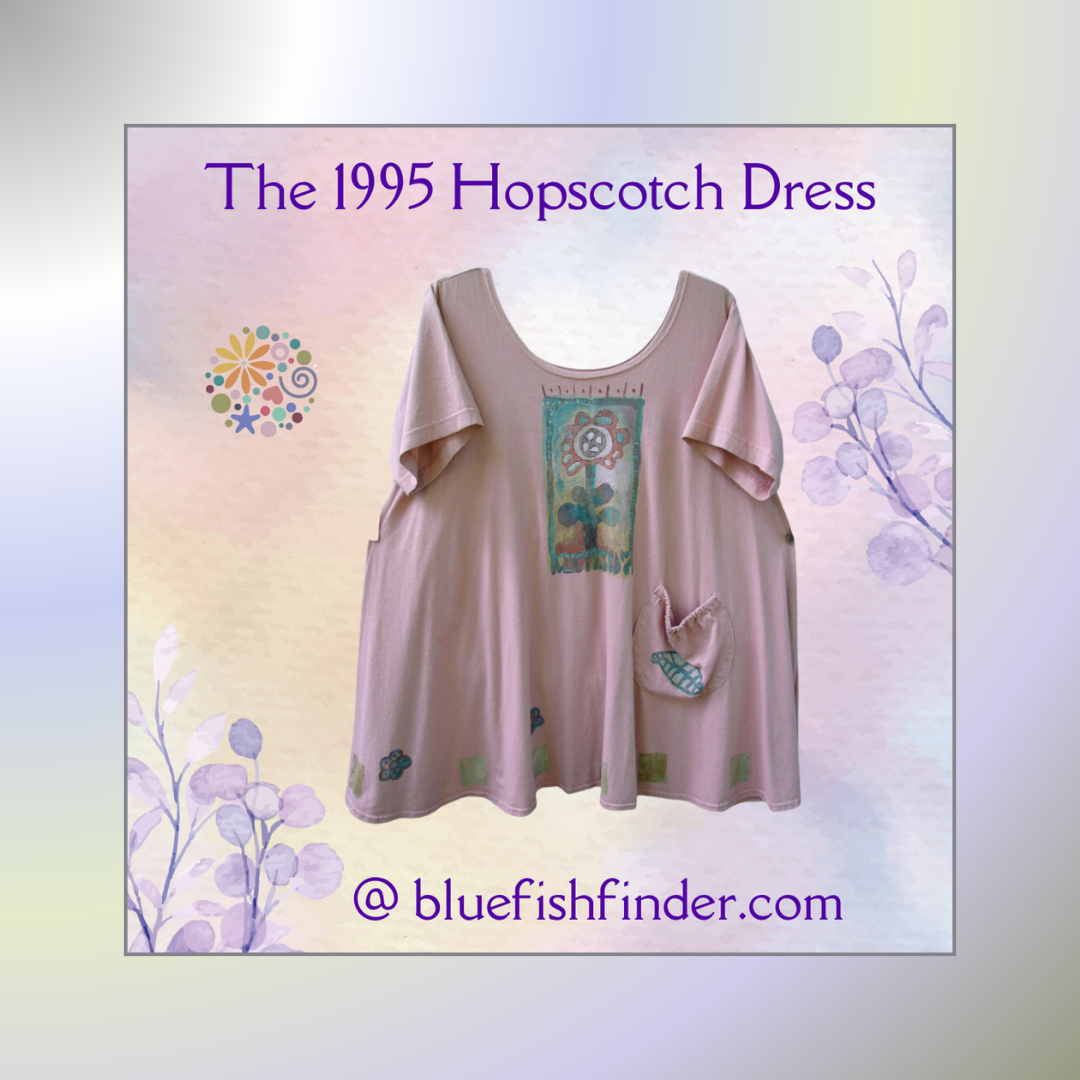 A pink baby doll dress called the Hopscotch dress from 1995 is displayed with a flower design and front drop pocket featuring a close-up of a flower and a colorful flower and circles. Background is pastel gradient matting of lavenders, Pinks and Blues.