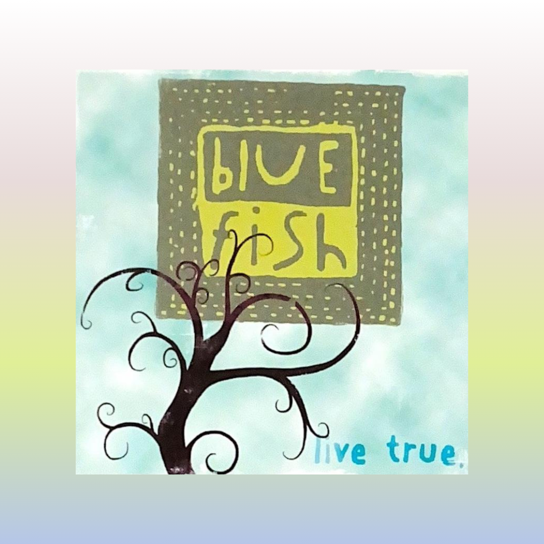 A strong bold back branched tree reaches to the center of the image overlapping the newer Blue Fish logo in a playful font done in olive and yellow. The message, "Live True is at the bottom of the card far right. Clouds appear in white and green.
