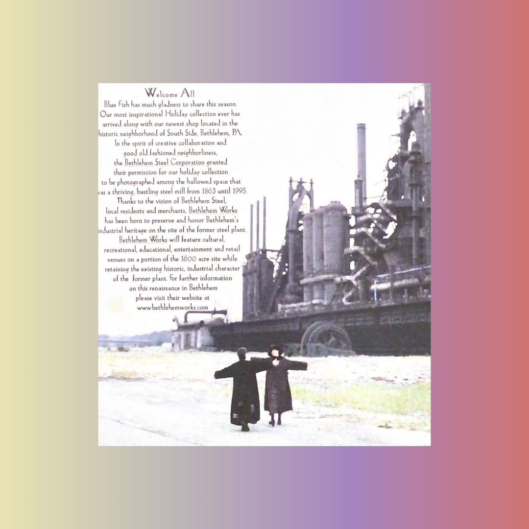 A collection image of Two models standing in front of the Bethlehem Steel factory on a vacant road, wearing the Tapestry Coats from the Winter 2000 collection. Lots of black text covers the left side of the image