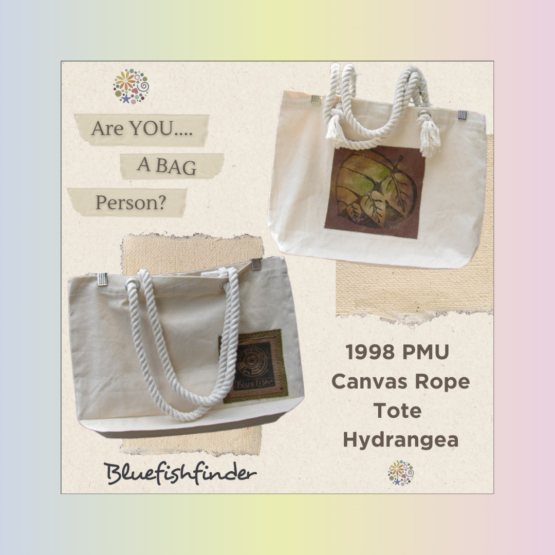 White handbag with rope handles, featuring black text on the front. Reflects the vintage, creative style of Blue Fish Clothing sold by Bluefishfinder.com.