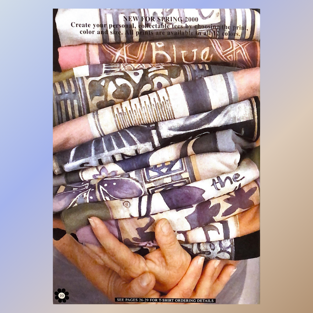 A stack of folded, screen-printed T-shirts in various patterns and colors, held in hands. Headline reads, NEW FOR SPRING 2000 – Create your personal, collectable tees.
