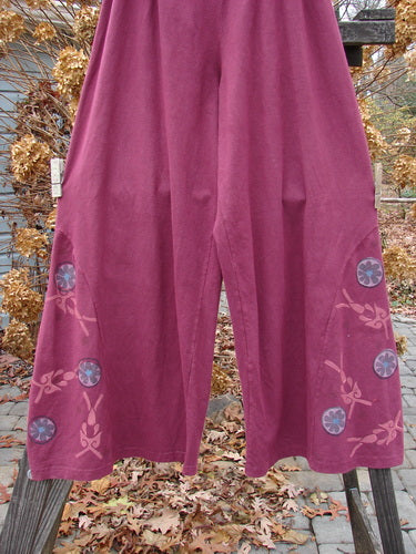 A pair of pink Barclay Hemp Cotton Empire Insert Pants with a unique side panel insert and lower circle floral paint. Size 2.