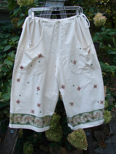 1993 Garden Pant Wind Flower Tea Dye Size 1 featuring side ties with metal grommets, deep front pockets, and a vintage floral theme, showcasing a wide, cropped design in medium-weight cotton.