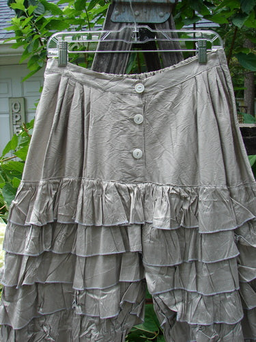 Magnolia Pearl Silk Voile Lace Alice in Wonderland Bloomer Silver Moss OSFA hanging on a clothesline, showcasing its intricate lace details and delicate fabric.