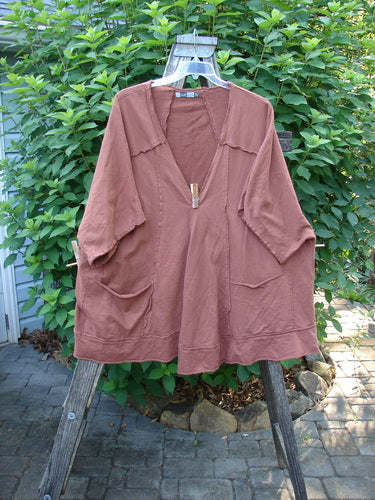 Barclay Photogram Open Front Santa Fe Jacket Garden Scrape Desert Clay OSFA displayed on a hanger, showcasing its wide three-quarter sleeves, angular hem, and dolman shoulders with visible raw edges.