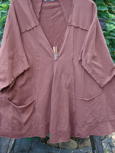 Barclay Photogram Open Front Santa Fe Jacket Garden Scrape Desert Clay OSFA, showcasing wide three-quarter sleeves, an angular hem, and raw edges, hangs on a clothesline, emphasizing its unique design and flow.