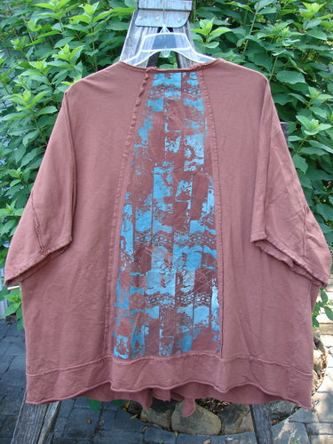 Barclay Photogram Open Front Santa Fe Jacket Garden Scrape Desert Clay OSFA, featuring wide three-quarter sleeves, an open front, angular hem, and raw edges, showcasing a unique garden scape design.