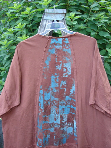 Barclay Photogram Open Front Santa Fe Jacket Garden Scrape Desert Clay OSFA features wide three-quarter sleeves, open front, angular hem, raw edges, and dolman shoulders with sectional panels.