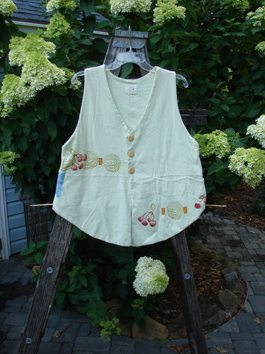 1999 Fork and Spoon Vest Cherry Celery Altered Size 1: A white vest with a cherry theme design, featuring three front pencil pockets, deep arm openings, a dramatic V neckline, and unique front and back cuts.