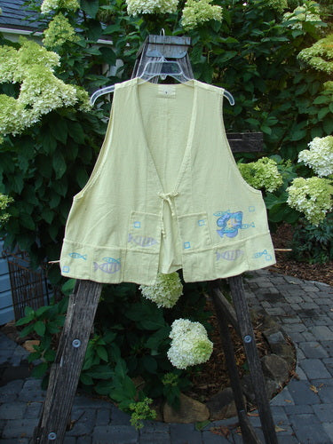 1999 Fishing Vest Fish School Citron Size 0, featuring fish embroidery, tie front, squared pockets, and a special rear pocket. Made from organic cotton with an easy A-line flare.