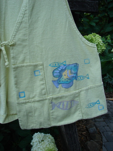 1999 Fishing Vest Fish School Citron Size 0, featuring painted blue fish, double-paneled front, squared pockets, deeper arm openings, and an easy A-line flare design made from organic cotton in perfect condition.