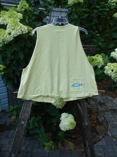 1999 Fishing Vest Fish School Citron Size 0 displayed on a wooden hanger, featuring tie front, double-paneled front pockets, deeper arm openings, and a unique fish school theme.