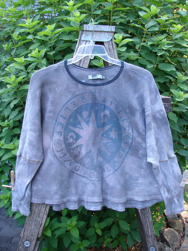 Barclay Thermal Crop Top Belief Spirit Mottled Plum River OSFA features a scooped neckline, A-line flair, and fitted lower sleeves, showcased on a hanger, highlighting its waffle texture and vintage-inspired design.
