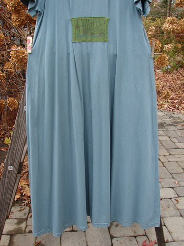 2000 PMU City Side Dress with painted pockets and unique rear patch, made from organic cotton. Size 1, 56" long.