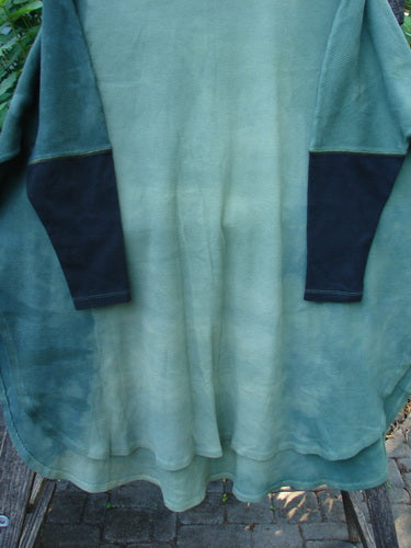 Barclay Thermal Contrast Revival Top Unpainted Mottled Field Moss OSFA, showcasing ribbed sleeves and neckline, with unique rounded A-line shape and side vents, emphasizing BlueFishFinder's vintage-inspired creative wear.
