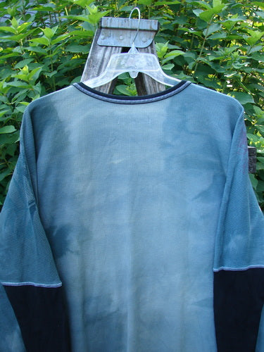 Barclay Thermal Contrast Revival Top Rose Garden Dusky Dusk OSFA displayed on a wooden stand, showcasing its ribbed sleeves, rounded neckline, and unique A-line shape with continuous farm theme design.