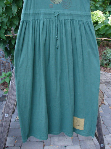 1997 Alcove Jumper Time Verdigris Altered Size 1 featuring a wide sweeping hemline and empire waist seam, displayed on a clothes rack.