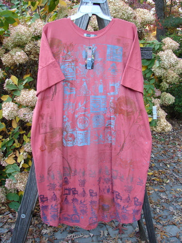 Barclay NWT Orcas Island Tunic Dress: Artful pink shirt with blue designs on wooden stand, featuring wider short sleeves and a drawcord back.