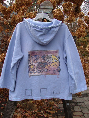 1999 Two Button Pullover Hooded Festive Moon Skylark Size L: A blue hooded sweatshirt with a picture of a moon and stars, featuring a heavier weighted French Terry fabric, versatile hooded pullover, and two larger front drop pockets.