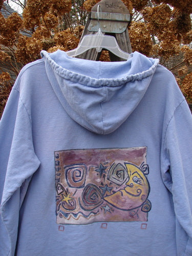 1999 Two Button Pullover Hooded Festive Moon Skylark Size L: a blue hoodie with a picture on it, from the Spring Collection of 1999. A versatile hooded pullover with a lovely A-line shape, two larger front drop pockets, and a super cozy hood with drawstring.