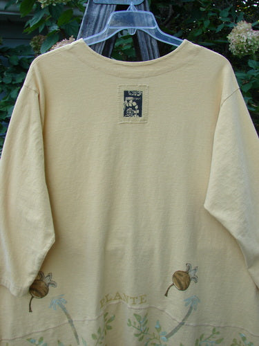 1998 Botanicals Orchard Jacket Vine Pod Sundial Size 2 on a hanger, featuring a wide-banded A-line hem, drop shoulders, rounded neckline, and a signature Blue Fish patch on the back.