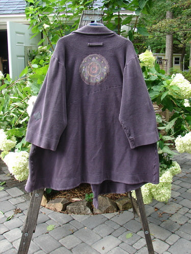 2000 PMU Celtic Moss Highlander Coat Aubergine Size 1, featuring oversized front buttons, multiple patches, and a big collared front.